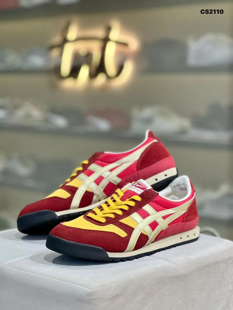 Crimson and gold retro trainers